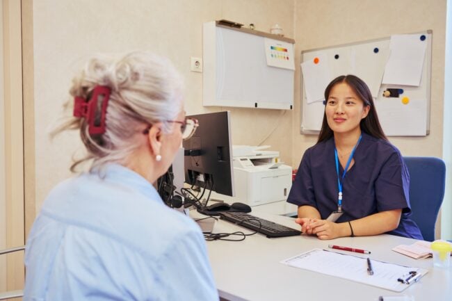 Doctors collaborating on patient care in modern hospital office