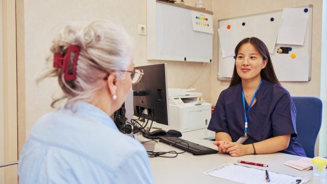 Doctors collaborating on patient care in modern hospital office